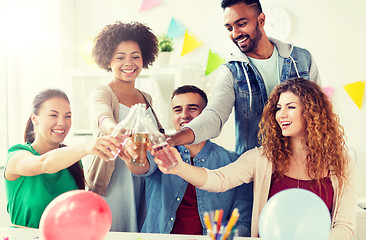 Image showing happy team with drinks celebrating at office party