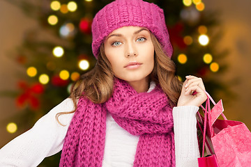 Image showing woman with shopping bags over christmas lights