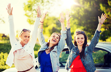 Image showing happy teenage girls or women near car at seaside