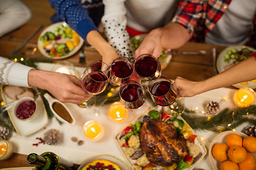 Image showing close up of friends with wine celebrate christmas