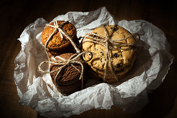 Image showing Shortbread, oat cookies, chocolate chip biscuit on wooden background.