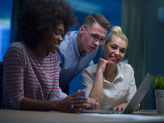 Image showing Multiethnic startup business team in night office