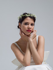 Image showing young bride sitting in a wedding dress