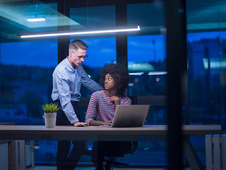 Image showing Multiethnic startup business team in night office