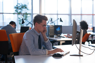 Image showing businessman working using a computer in startup office