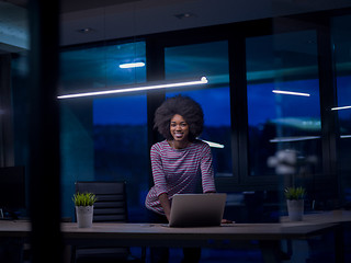 Image showing black businesswoman using a laptop in startup office