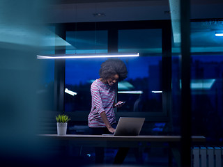 Image showing black businesswoman using a laptop in startup office