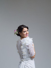 Image showing Rear view of a beautiful young woman in a wedding dress