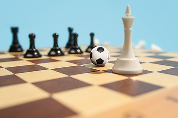 Image showing soccer ball of chess pieces on the board