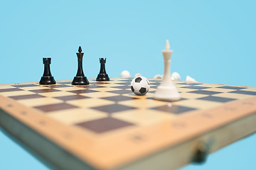 Image showing soccer ball of chess pieces on the board