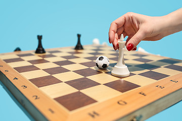 Image showing soccer ball of chess pieces on the board