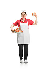 Image showing Portrait of cute smiling woman with pastries in her hands in the studio, isolated on white background