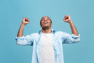 Image showing Winning success man happy ecstatic celebrating being a winner. Dynamic energetic image of male model