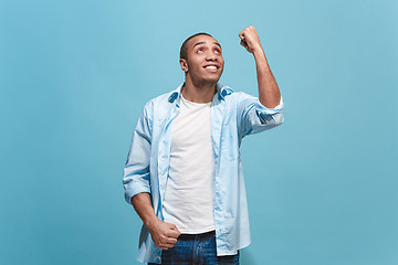 Image showing Winning success man happy ecstatic celebrating being a winner. Dynamic energetic image of male model