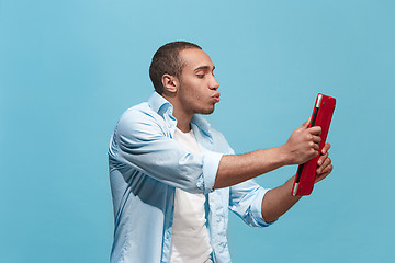 Image showing Businessman hugging laptop