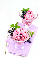 Image showing Ice cream with black currant in two glasses on napkin