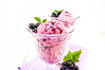 Image showing Ice cream with black currant on light board