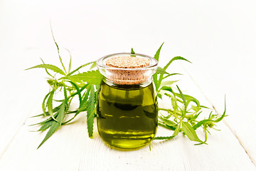 Image showing Oil hemp in jar with sheet on light board