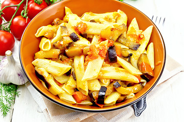 Image showing Pasta penne with eggplant and tomatoes on kitchen towel