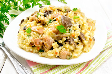 Image showing Risotto with mushrooms and chicken on table