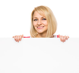 Image showing Woman with blank signboard