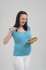 Image showing Pregnant woman on gray