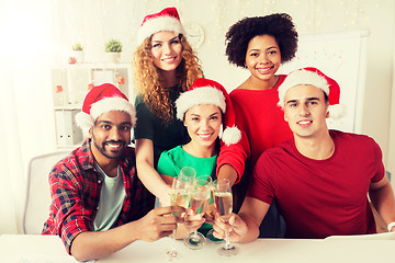 Image showing happy team celebrating christmas at office party