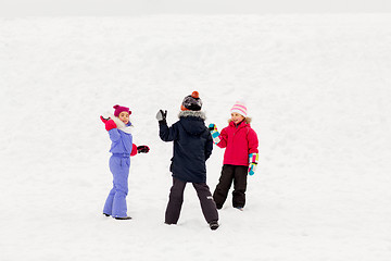 Image showing happy little kids playing outdoors in winter