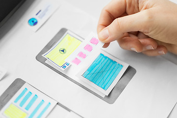 Image showing web designer working on user interface wireframe