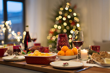 Image showing food and drinks on christmas table at home