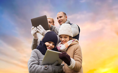 Image showing family with tablet pc computers over sky