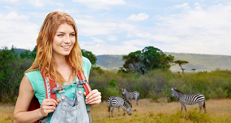 Image showing happy woman with backpack over african savannah