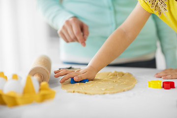 Image showing mother and daughter making cookies at home