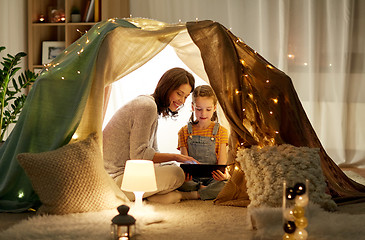 Image showing family with tablet pc in kids tent at home