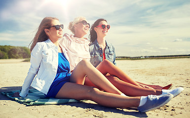 Image showing group of smiling women in sunglasses on beach