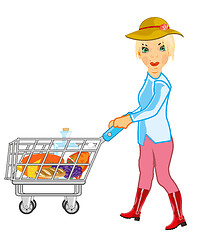 Image showing Girl in shop rolls pushcart with product