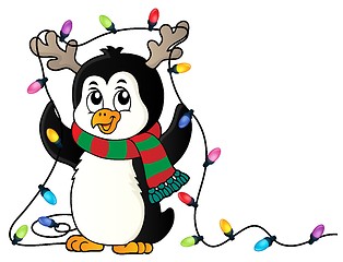 Image showing Penguin with Christmas lights image 1