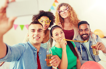 Image showing happy team taking selfie at office party