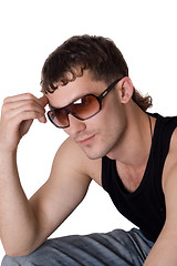 Image showing Young man in sunglasses. Isolated on white background 1