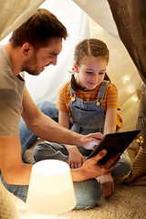 Image showing family with tablet pc in kids tent at home