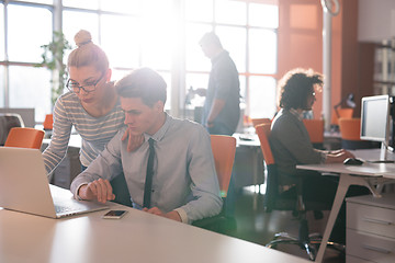 Image showing Two Business People Working With laptop in office