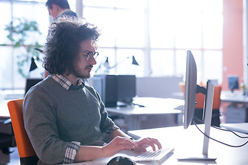 Image showing businessman working using a computer in startup office