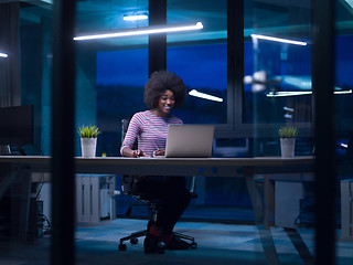 Image showing black businesswoman using a laptop in startup office