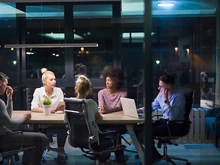 Image showing Multiethnic startup business team in night office