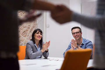 Image showing cloasing the deal in modern office interior