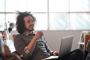 Image showing businessman working using a laptop in startup office