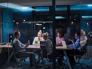 Image showing Multiethnic startup business team in night office