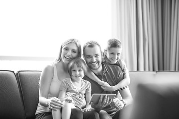 Image showing happy young couple spending time with kids