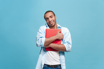 Image showing Businessman hugging laptop