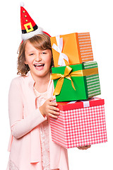 Image showing Girl in santa hat with gift box